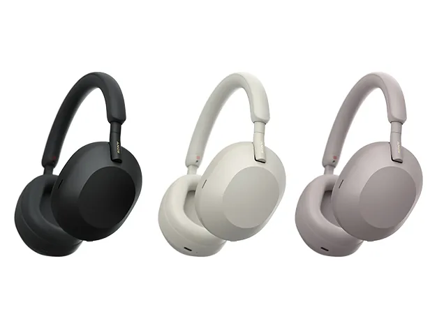 Three Sony WH-1000XM5 wireless noise cancelling headphones in black, platinum silver and smoky pink