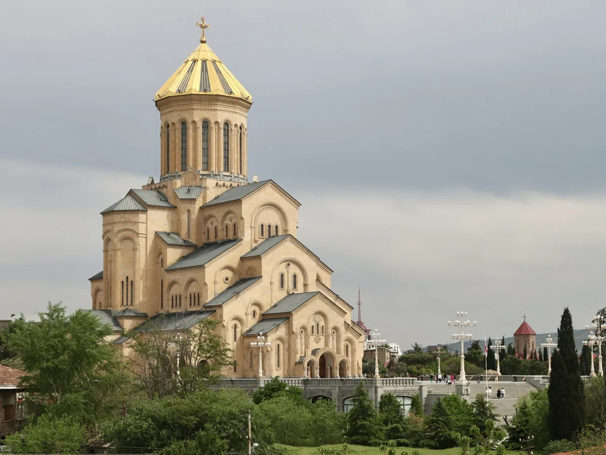 Church with a golden dome in Tbilisi on a cloudy day