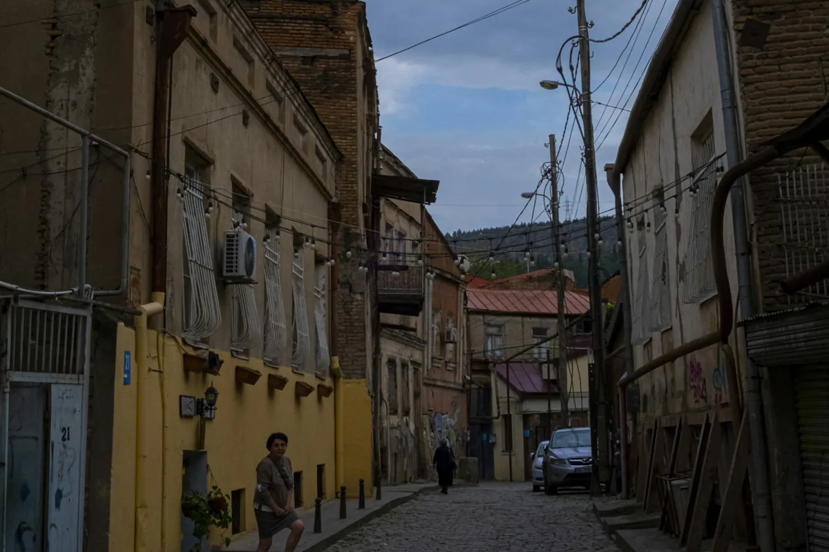 Cobblestone street with old buildings in Tbilisi