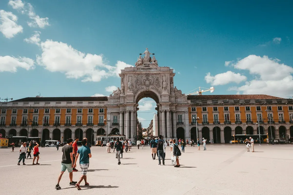 Rua Augusta Arch and Praca do Comercio in Lisbon, a city where nomads withdraw cash in Europe